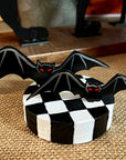 Bats Table Topper on Checked Base