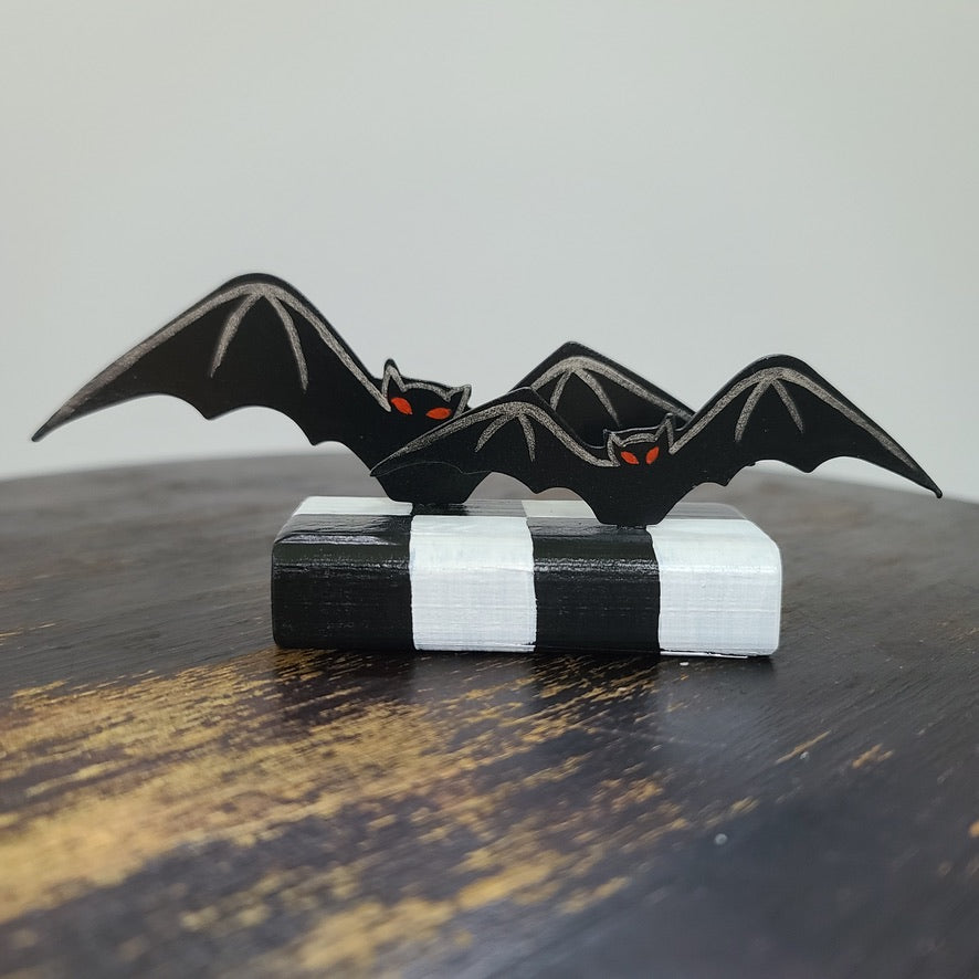 Bats Table Topper on Checked Base