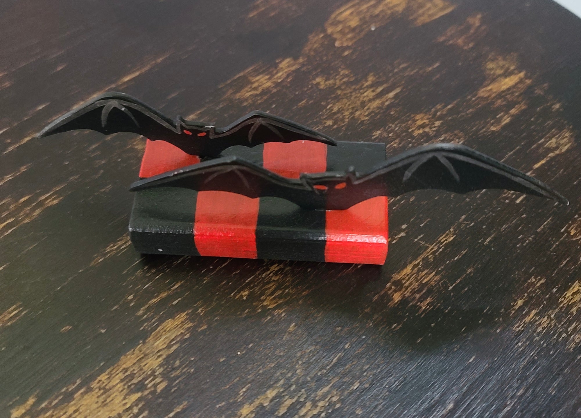 Bats Table Topper on Checked Base