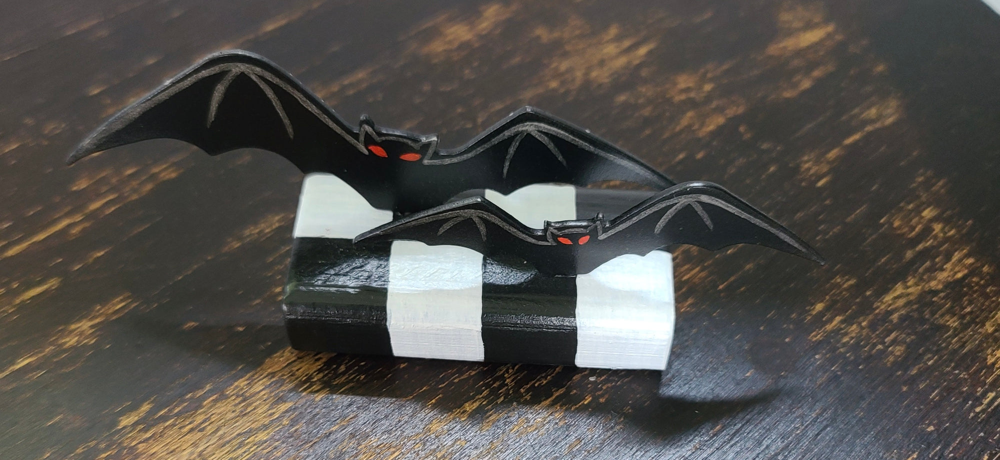 Bats Table Topper on Checked Base