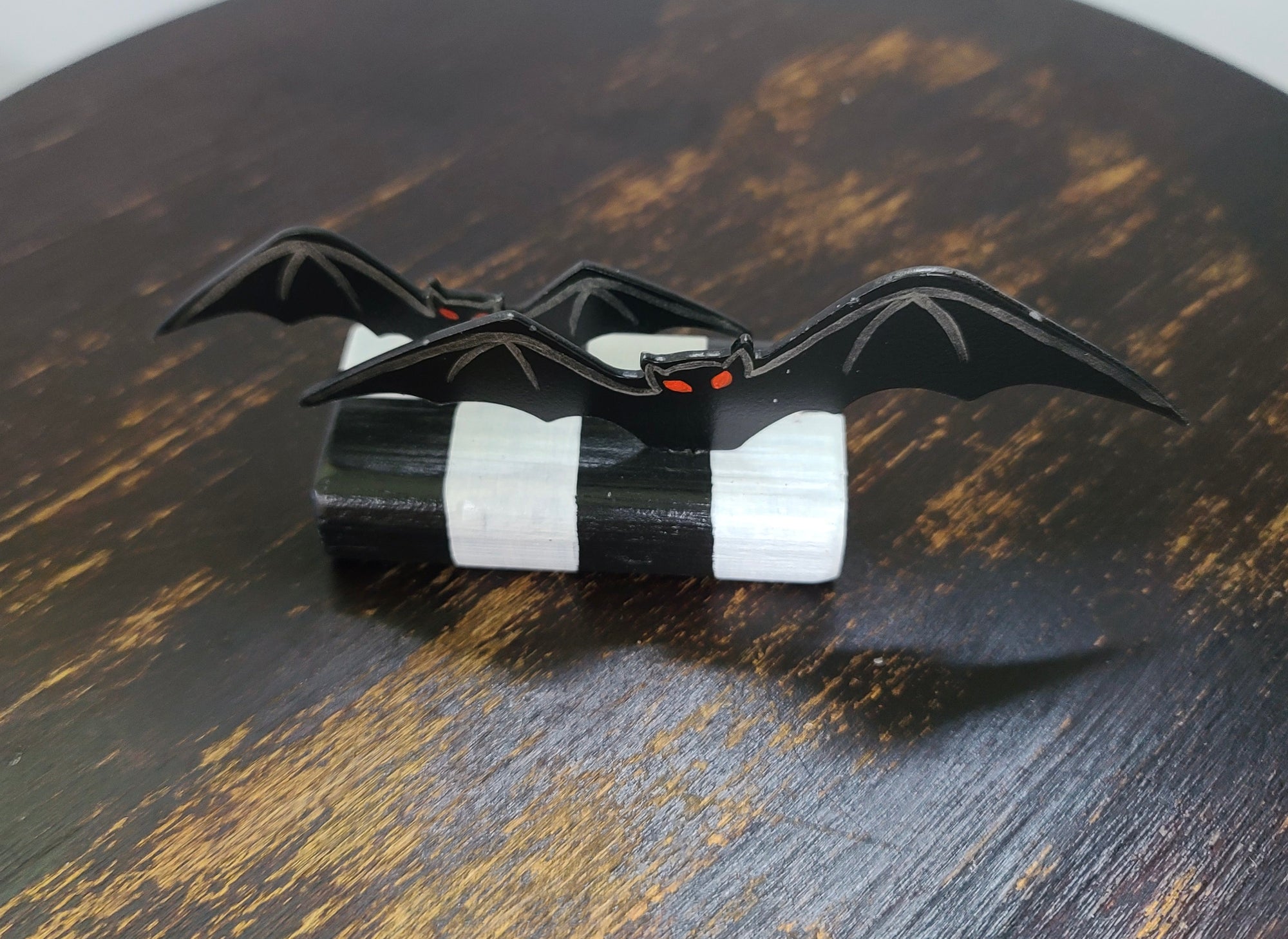 Bats Table Topper on Checked Base