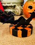 Bats Table Topper on Checked Base